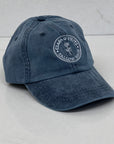 Garment-Washed Logo Hat in Midnight Blue, featuring Clara & Fritz logo, made from soft cotton twill, perfect for sunny days and casual outings.