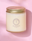 Tallow-Based Oil Cleanser in jar on pink background for balanced skin