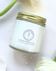 Clear Complexion Whipped Tallow Facial Moisturizer jar on floral background