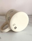 Clara & Fritz Cottage Mug with Milk Made Studio logo on base, showcasing unique design and fine craftsmanship.