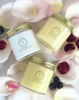 Daily Facial Trio from Clara & Fritz - Tallow based skincare products surrounded by rose petals and berries. Full-size skincare jars