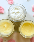 Daily Facial Trio from Clara & Fritz featuring tallow based skincare products in jars on white background with pink petals.