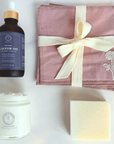 Elevated Essentials Set with castor oil, facial cloths, skincare balm, and soap, perfect for natural skincare enthusiasts.