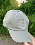 Clara & Fritz Garment-Washed Logo Hat in Stone with lived-in feel, featuring stylish design ideal for sunny days and outdoor adventures.