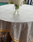Seaside Garden Block Print Tablecloth on dining table with vase centerpiece, floral design, handcrafted in Jaipur, perfect for gatherings.