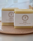 Set of 2 Mary Tallow Unscented Soap bars on a plate, showcasing natural skincare benefits.