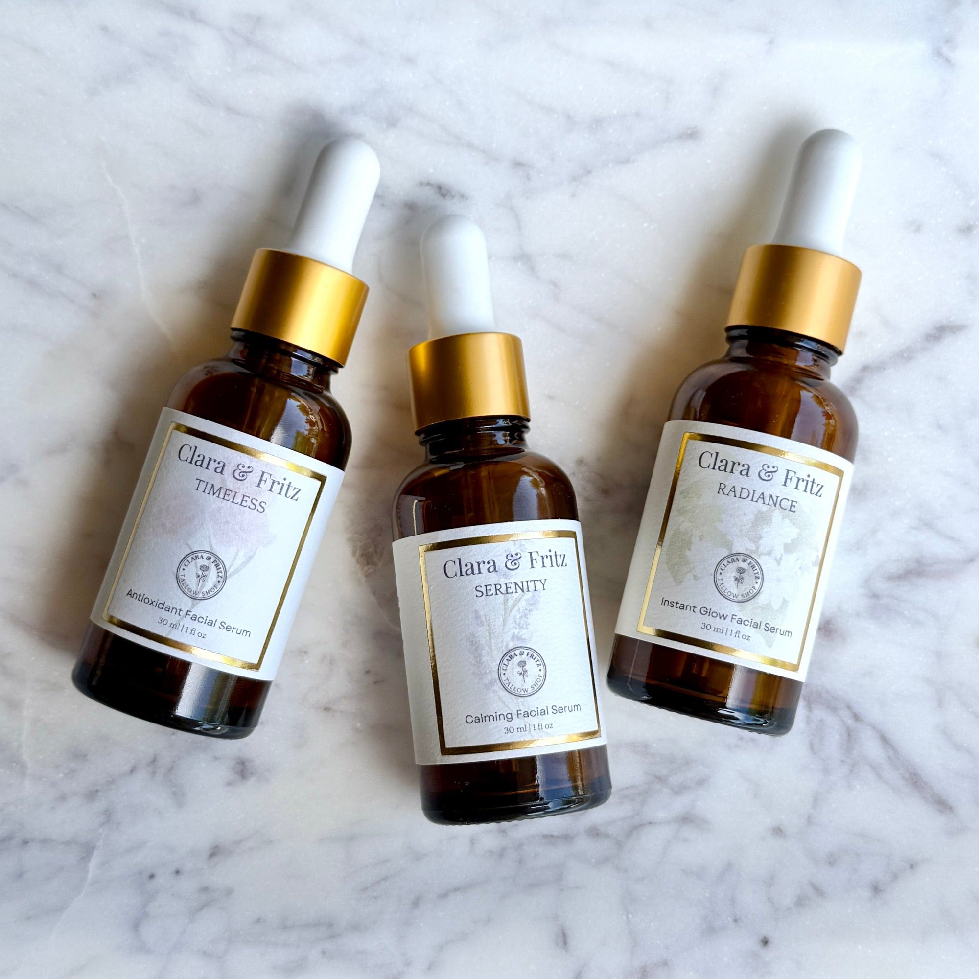 The Serum Trio: Clara & Fritz complete serum collection for balanced, glowing skin with nourishing benefits in amber bottles.