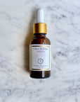 Amber bottle of Timeless Antioxidant Facial Serum on marble background