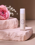 Clara and Fritz lip balm from Lip Balm Set product photo with rose on block
