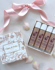 Lip Balm Set boxed with four vanilla scented balms, decorative packaging, and a pink ribbon, ideal for gifts and deep hydration.