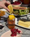 Colorful brunch with Garden Rose Juice Glass, fresh fruits, and a hint of lemon.