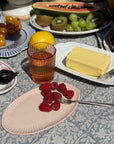 Heirloom Vanity Tray with figs, raspberries, and butter on Seaside Garden Block Print Tablecloth.
