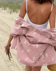 Clover Lounge Set in dusty rose, 100% organic cotton, with embroidered motif, perfect for a relaxed and stylish beach day.