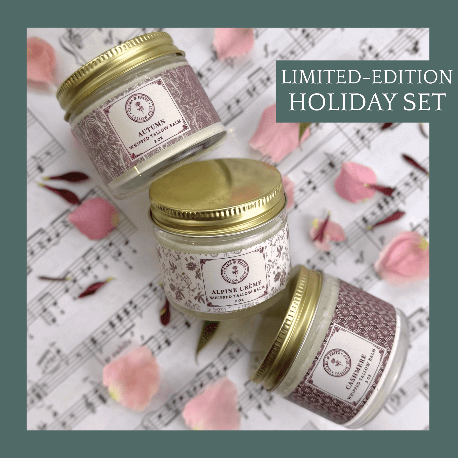 Limited-edition Seasonal Scent Gift Set balm jars on sheet music with flower petals.