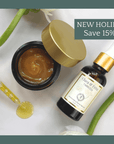 Timeless Serum and Antioxidant Balm Set on display with dropper, save 15% holiday promo, skincare for age support and hydration.