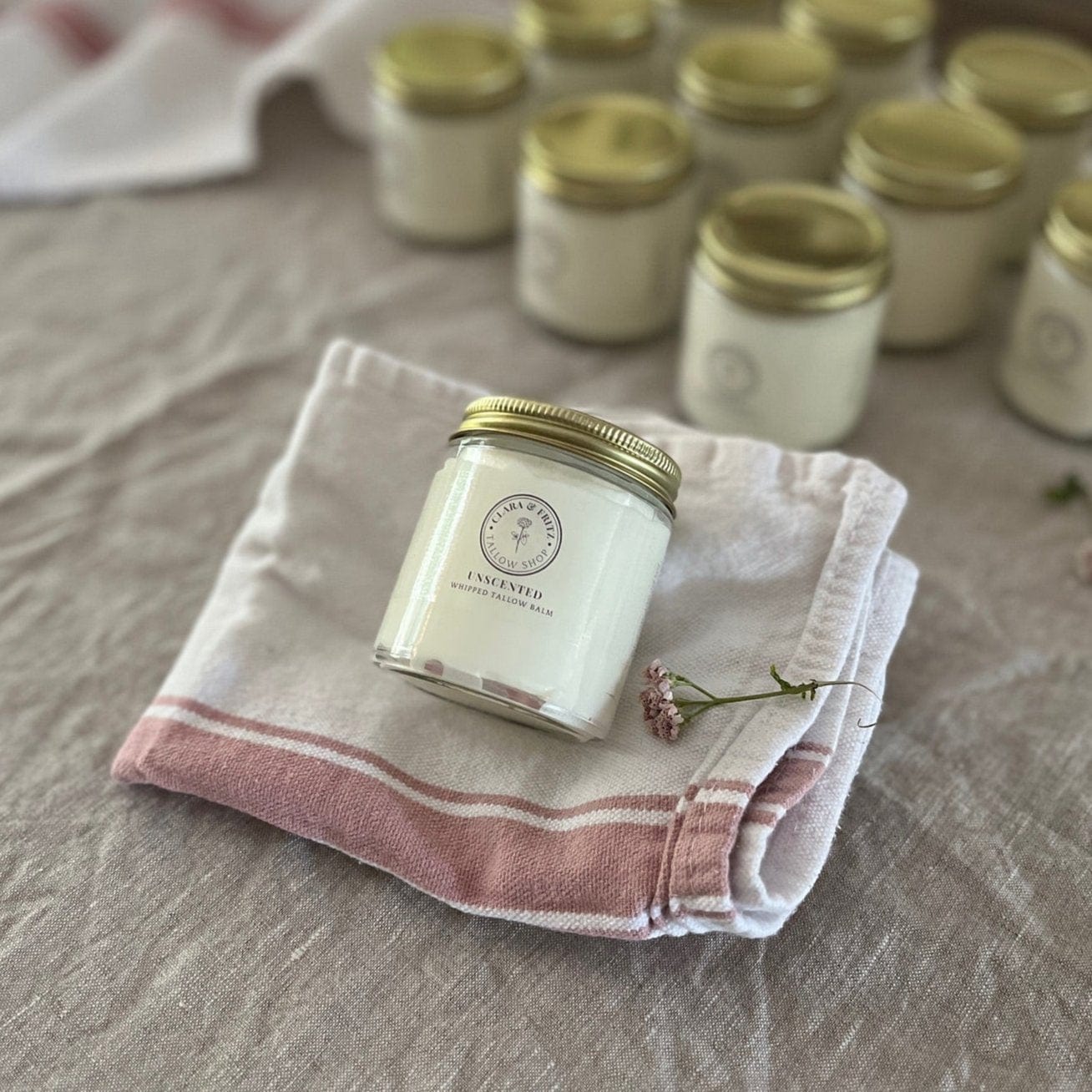 Whipped Pure Hydration Set featuring unscented whipped tallow balm jar over folded towels, offering gentle skincare with hydration benefits.