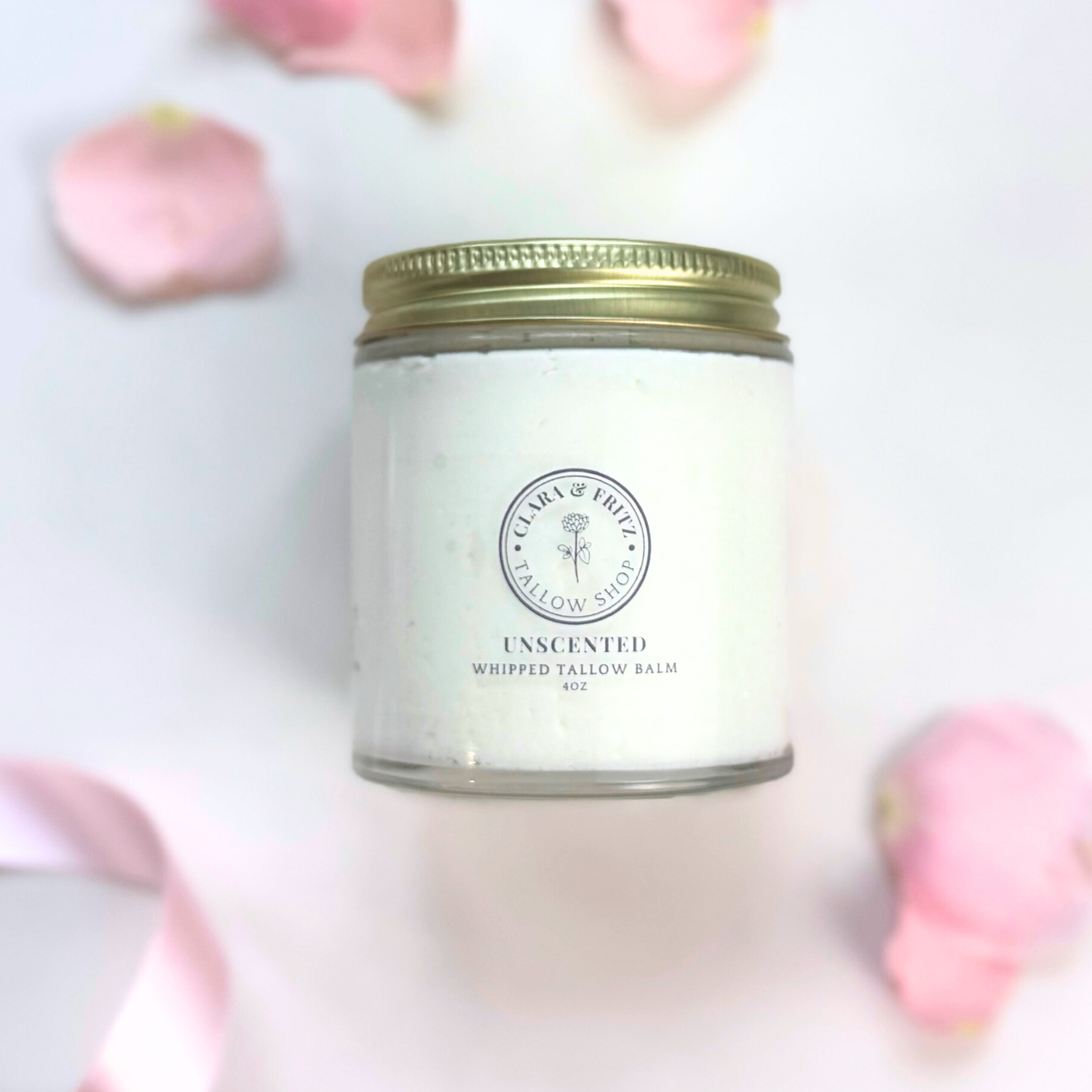 Jar of Clara & Fritz Unscented Whipped Tallow Balm with pink petals
