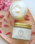 Clear Complexion Whipped Tallow Facial Moisturizer jar and cream on floral pink tray