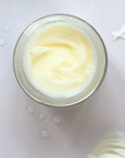Jar of Unscented Solid Tallow Balm Moisturizer with organic jojoba oil, designed for temperature resilience and uncompromised skincare purity.