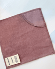 Clover Organic Cotton Washcloth Set of 4 in mauve on white surface, showcasing soft texture and quality craftsmanship.