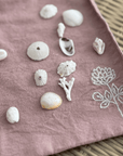 Clover Organic Cotton Washcloth Set of 4 with seashells and embroidery, showcasing soft, eco-friendly design.