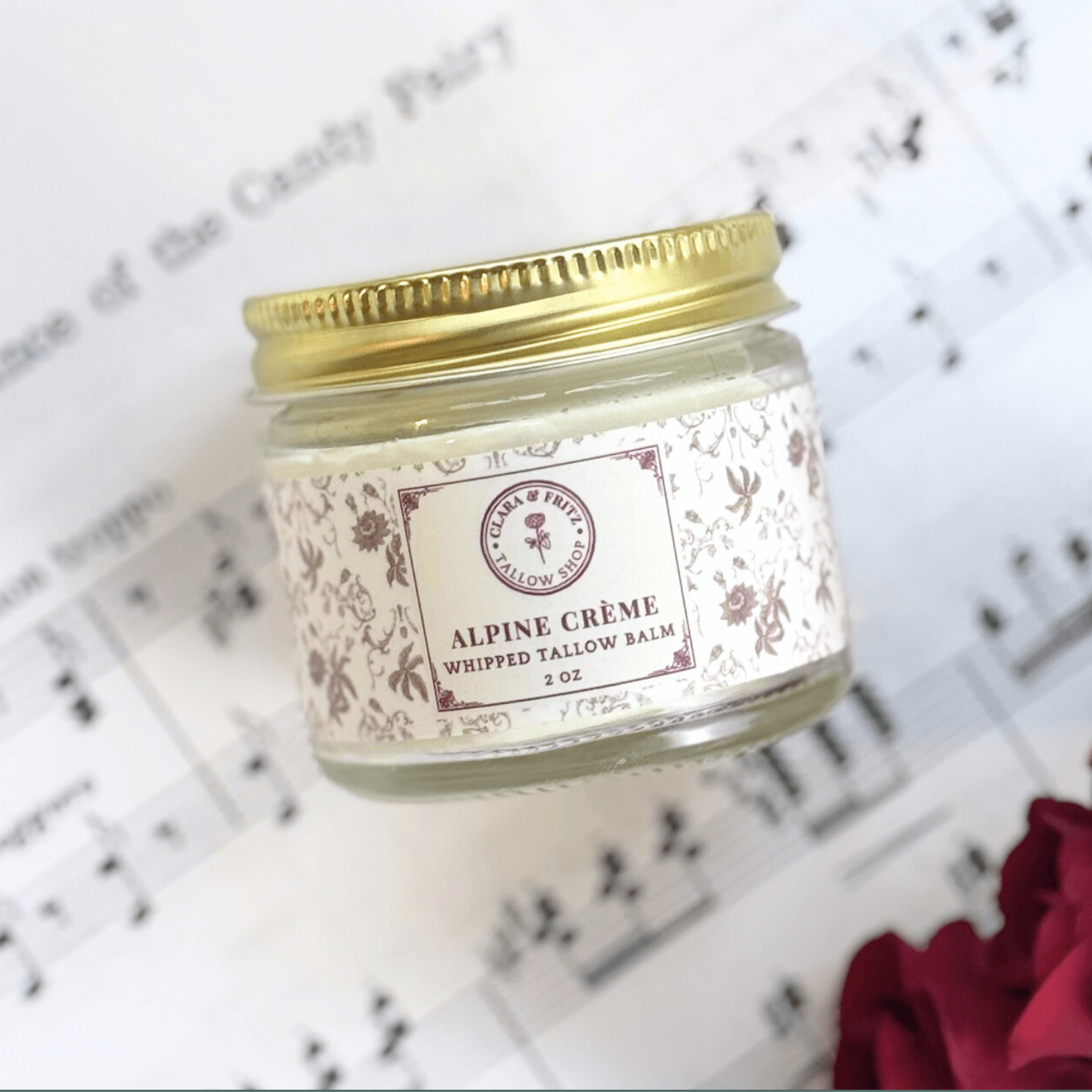 Seasonal Scent Gift Set featuring Alpine Crème whipped tallow balm jar on sheet music background.