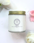 Scented whipped tallow balm jar with floral accents, ideal for nourishing skin care.