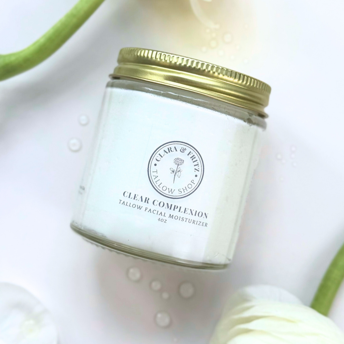 Clear Complexion Whipped Tallow Facial Moisturizer jar on floral background