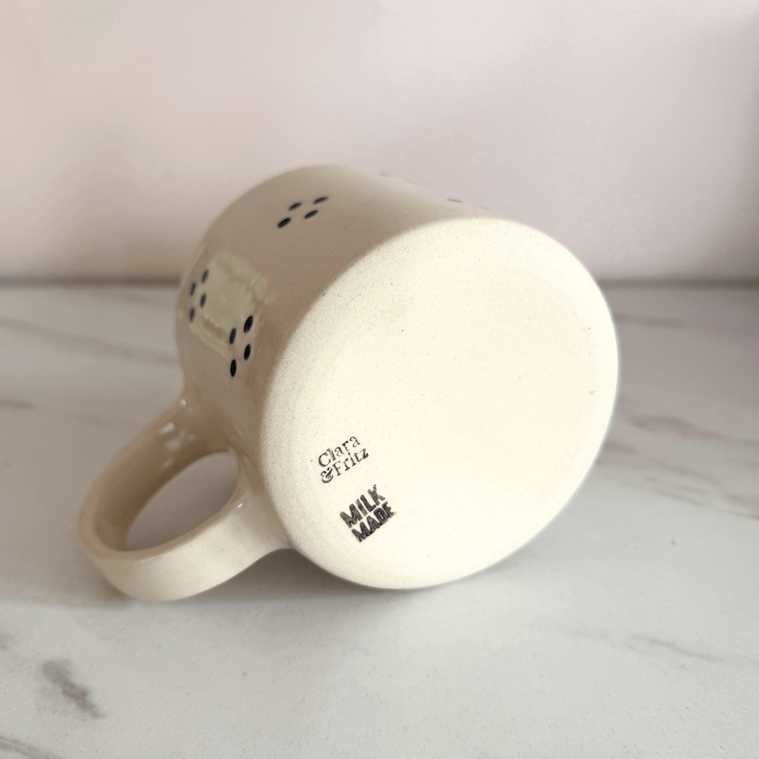 Clara & Fritz Cottage Mug with Milk Made Studio logo on base, showcasing unique design and fine craftsmanship.