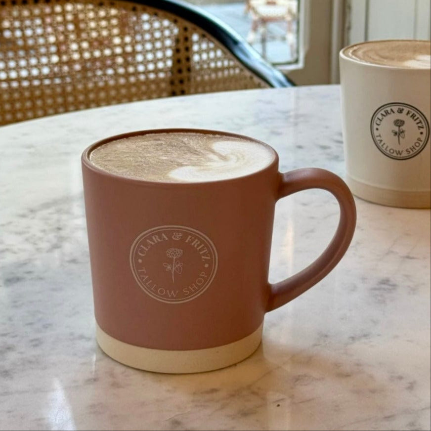 Latte Mug with Clara & Fritz logo on a marble table, perfect for coffee lovers, ceramic mug with matte glaze, ideal gift choice