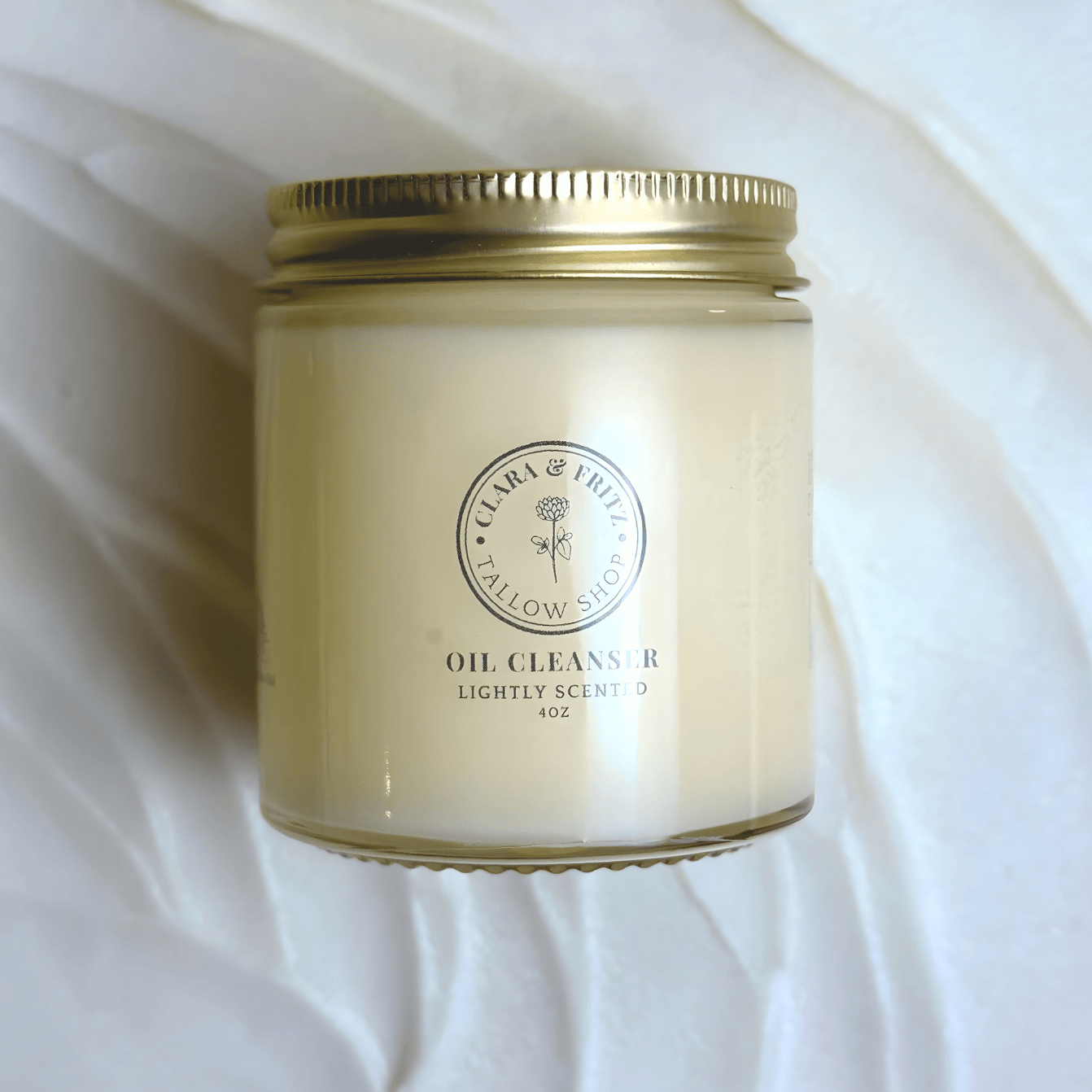 The Timeless Routine Tallow-Based Oil Cleanser in a 4oz jar with gold lid, designed for ageless, beautiful skin naturally.